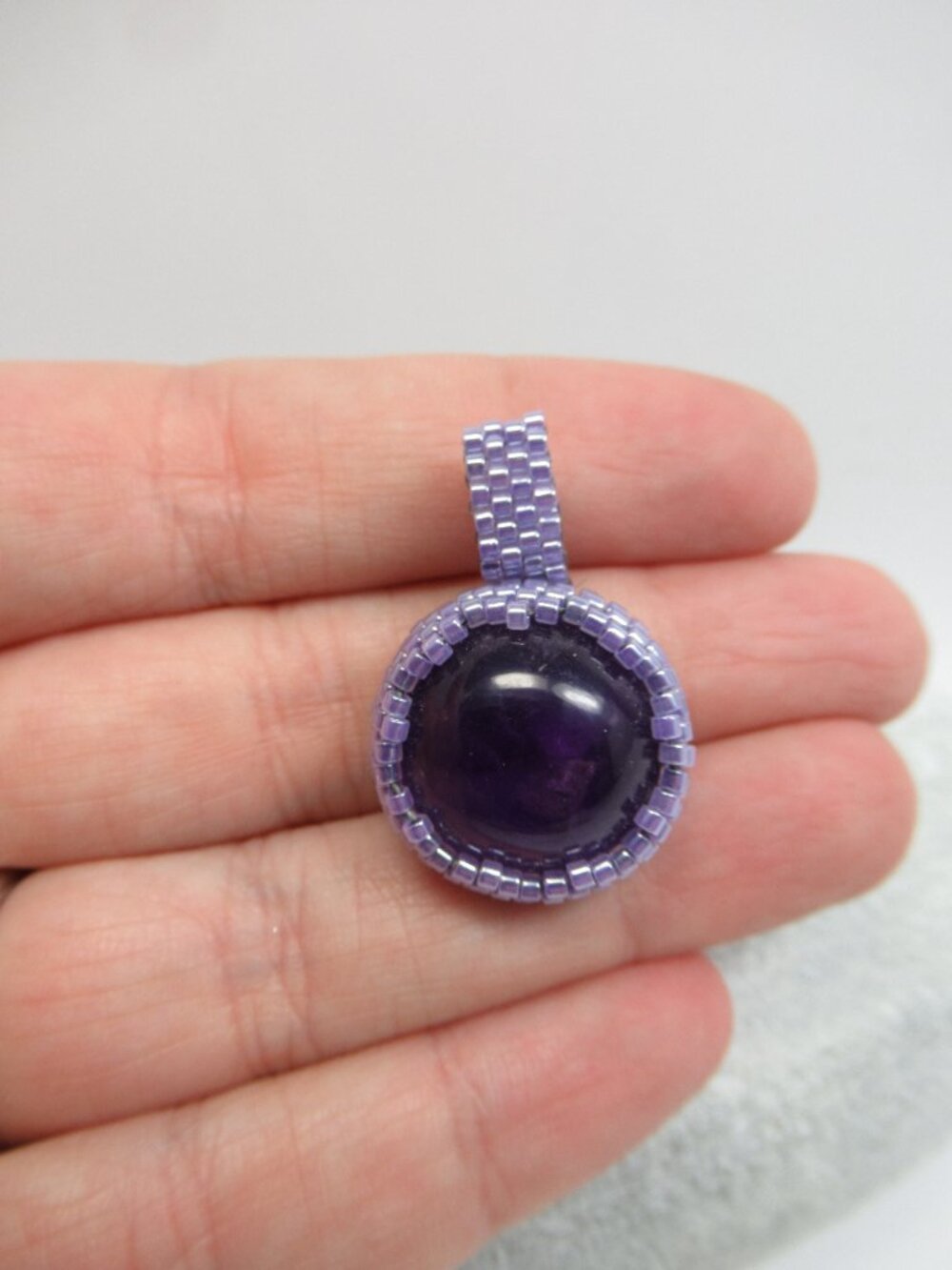 Amethyst hand stitched pendant